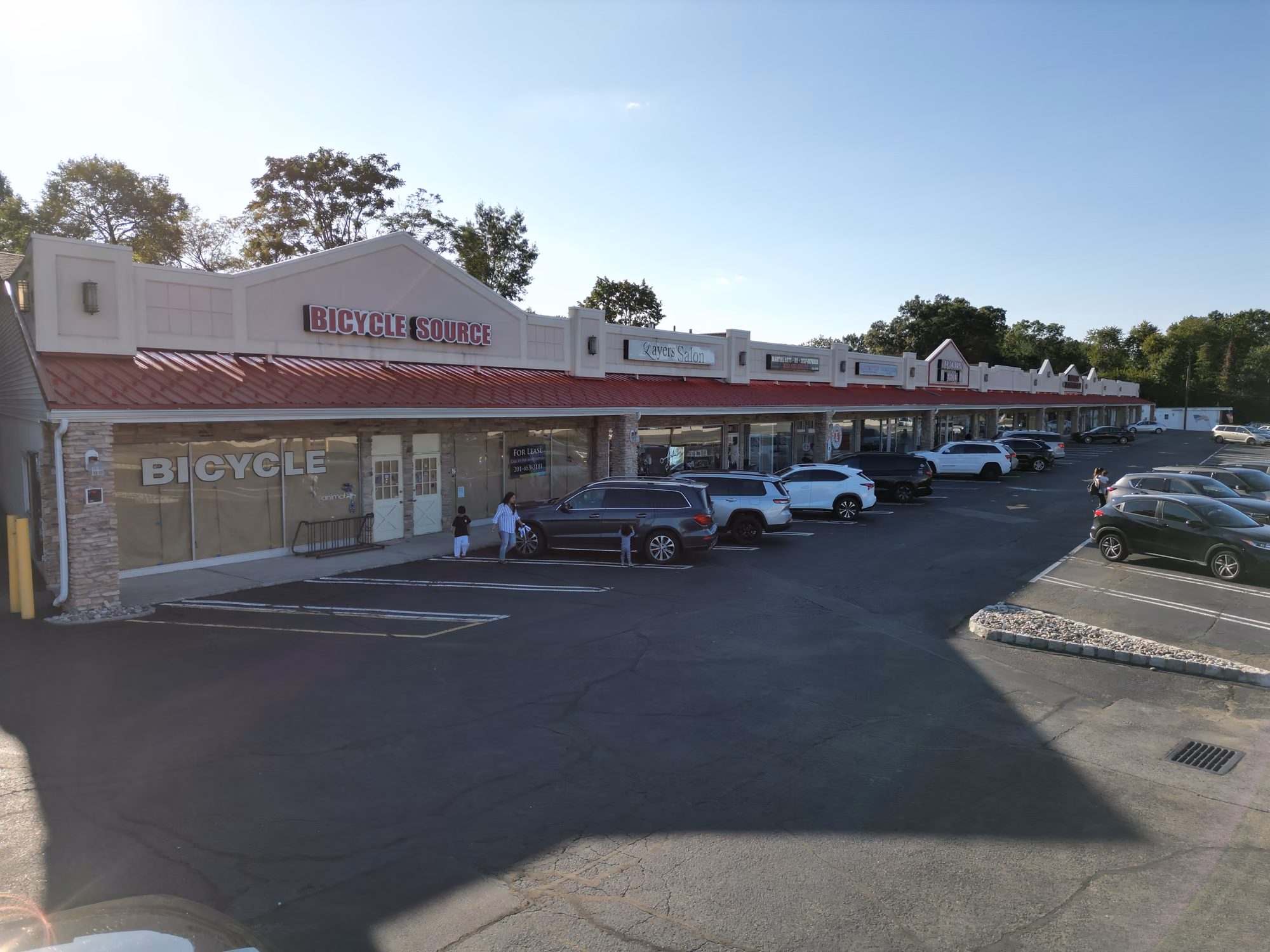 Before — At acquisition — a dated façade, deferred maintenance and below-market leases.